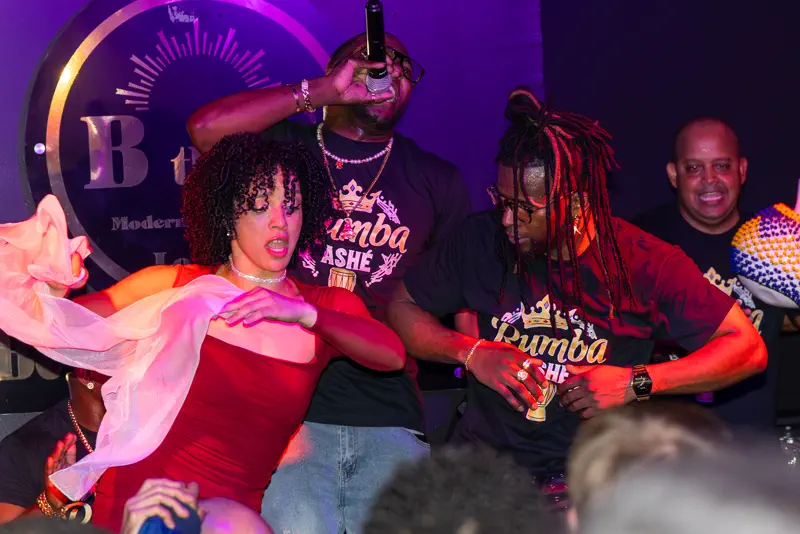 Live band and a dancer on the floor at a CLOO Entertainment night.