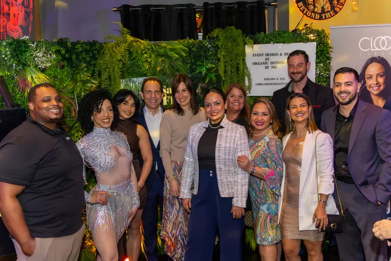 Guests at Salsa Flow & Networking 2026 in front of the CLOO backdrop.